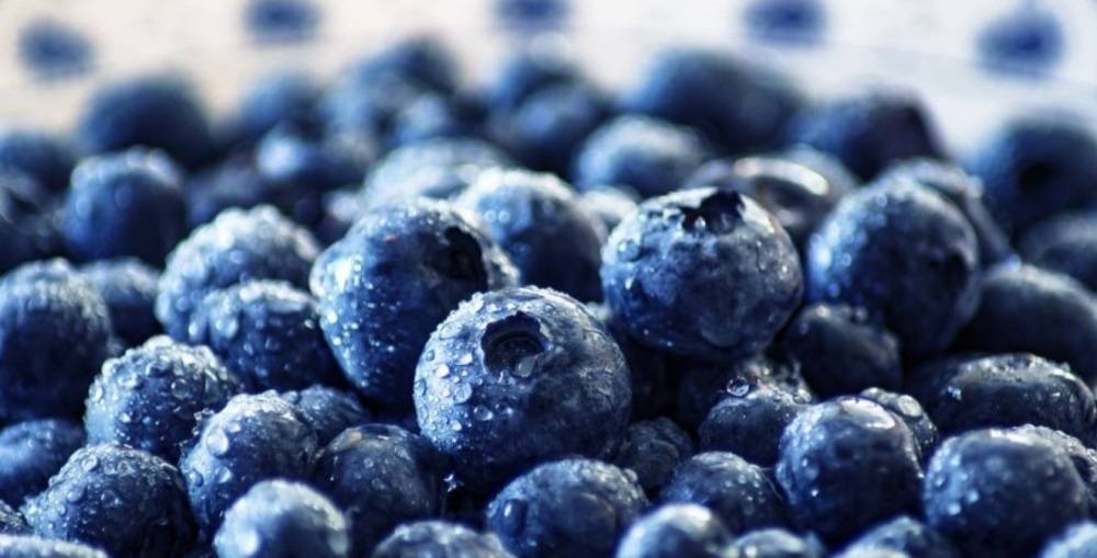 Road during heavy rain. raindrops on water puddles bad weather