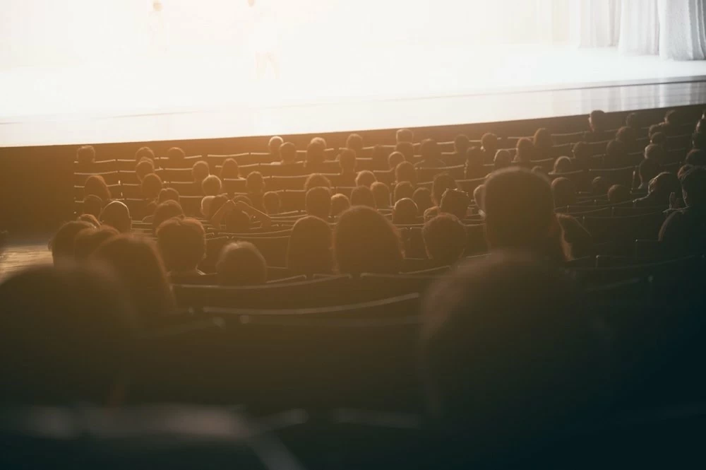 blurry background of People watching movies in movie theaters