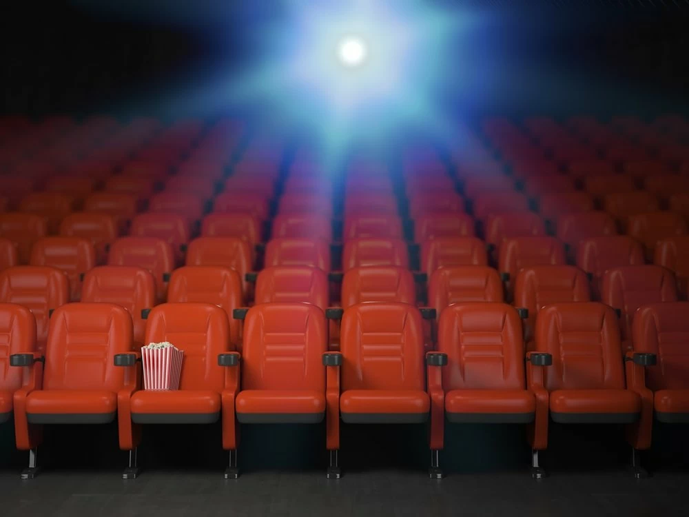 Cinema and movie theater concept background. Empty rows of red seats with pop corn. 3d illustration