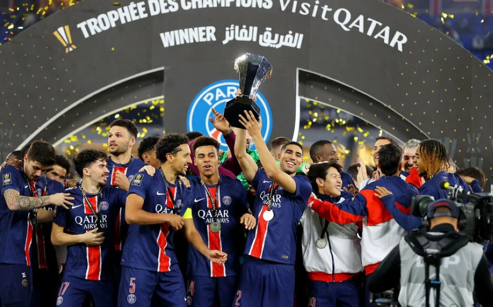 Soccer Football - Trophee des Champions - Final - Paris St Germain v AS Monaco - Stadium 974, Doha, Qatar - January 5, 2025
Paris St Germain players celebrate with the trophy after winning the French Super Cup REUTERS/Ibraheem Al Omari